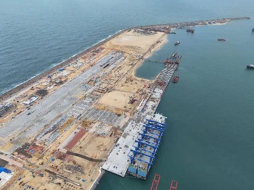 CWIT's construction site with breakwater and ships.