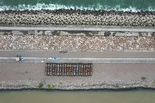 Engineered shoreline with concrete blocks and road at CWIT.