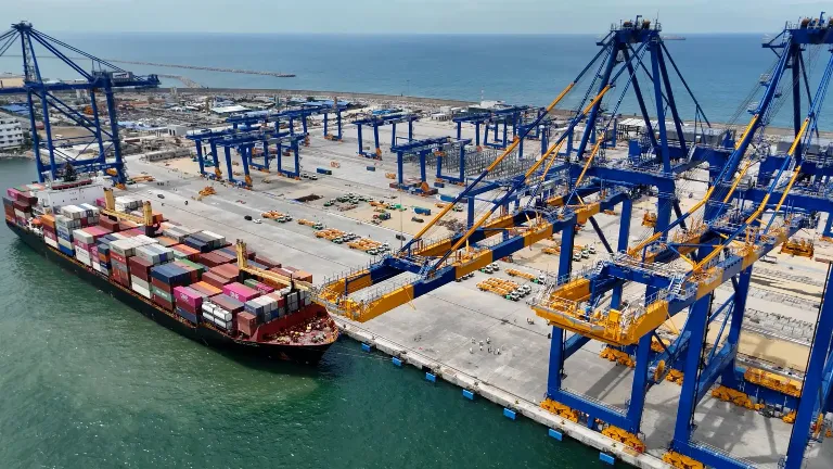 An aerial view of the CWIT including its berth, yard, quay cranes and ships.