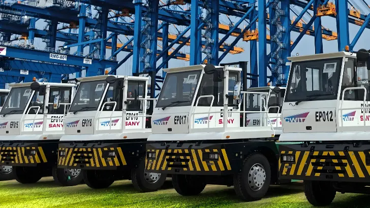 Electric trucks and quay cranes at CWIT.